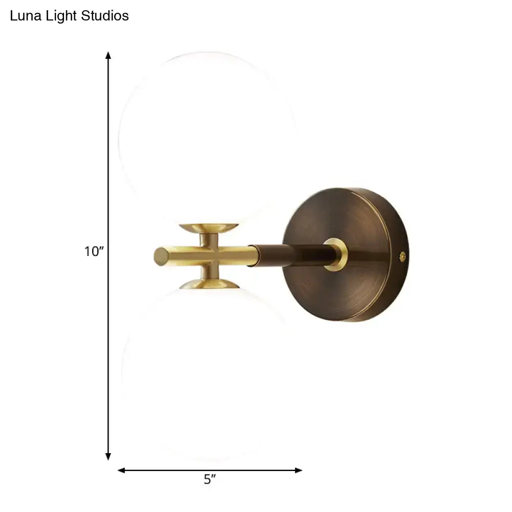 Modern brass and white glass wall sconce – bedroom globe light