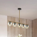 Modern brass dining room pendant light with cognac glass shades