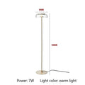 Modern brass floor lamp with glass lampshade for living room