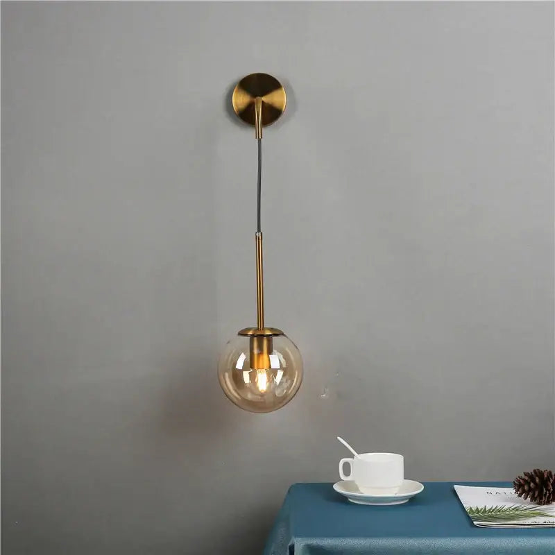 Modern brass glass ball wall lamp bedroom amber globe lighting