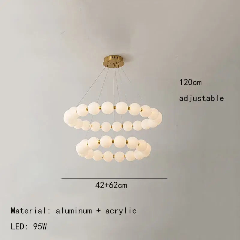 Modern brass led pendant light with frosted spheres for living room