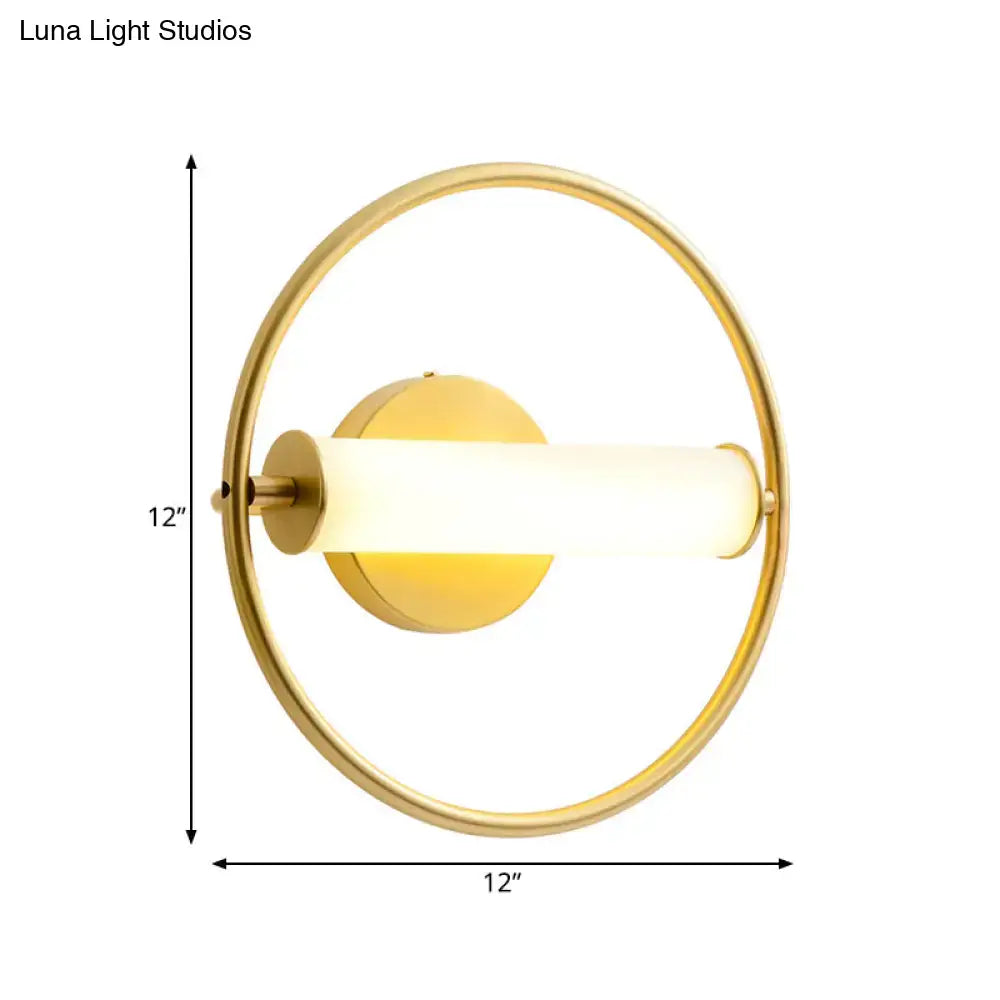 Modern brass ring wall sconce with opal glass shade bedroom light