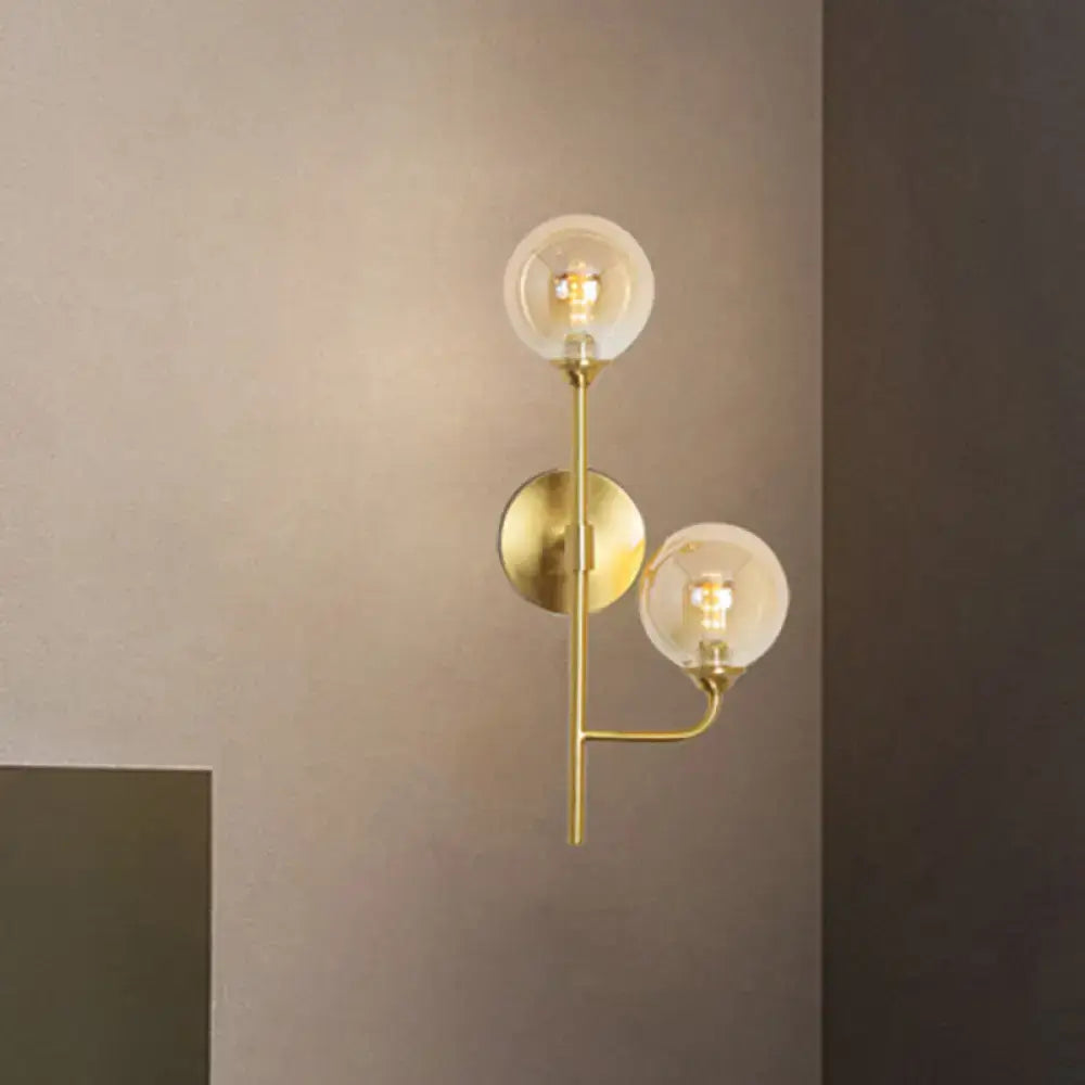 Modern brass sphere wall sconce amber & smoke gray bathroom light