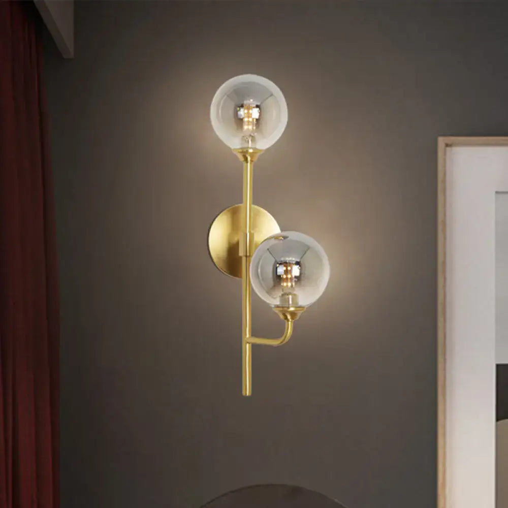Modern brass sphere wall sconce amber & smoke gray bathroom light