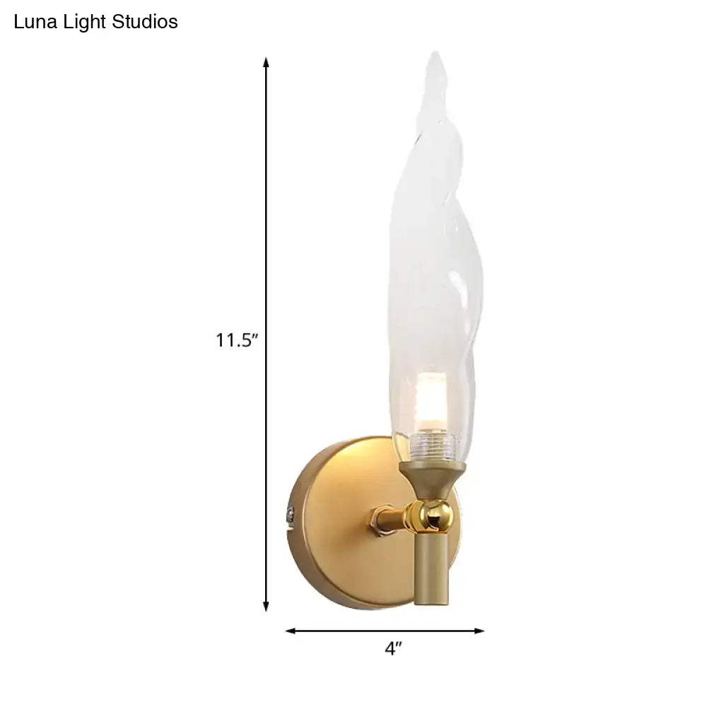 Modern brass torch sconce with clear glass bedroom wall lamp