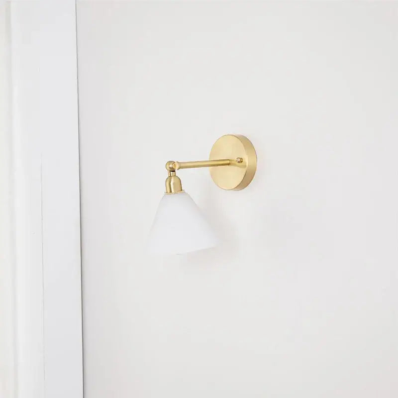 Modern brass wall lamp with clear glass shade bedroom reading light