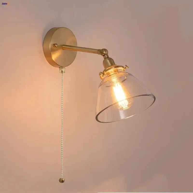 Modern brass wall lamp with clear glass shade bedroom reading light