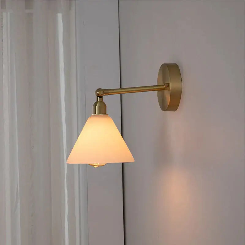 Modern brass wall lamp with clear glass shade bedroom reading light