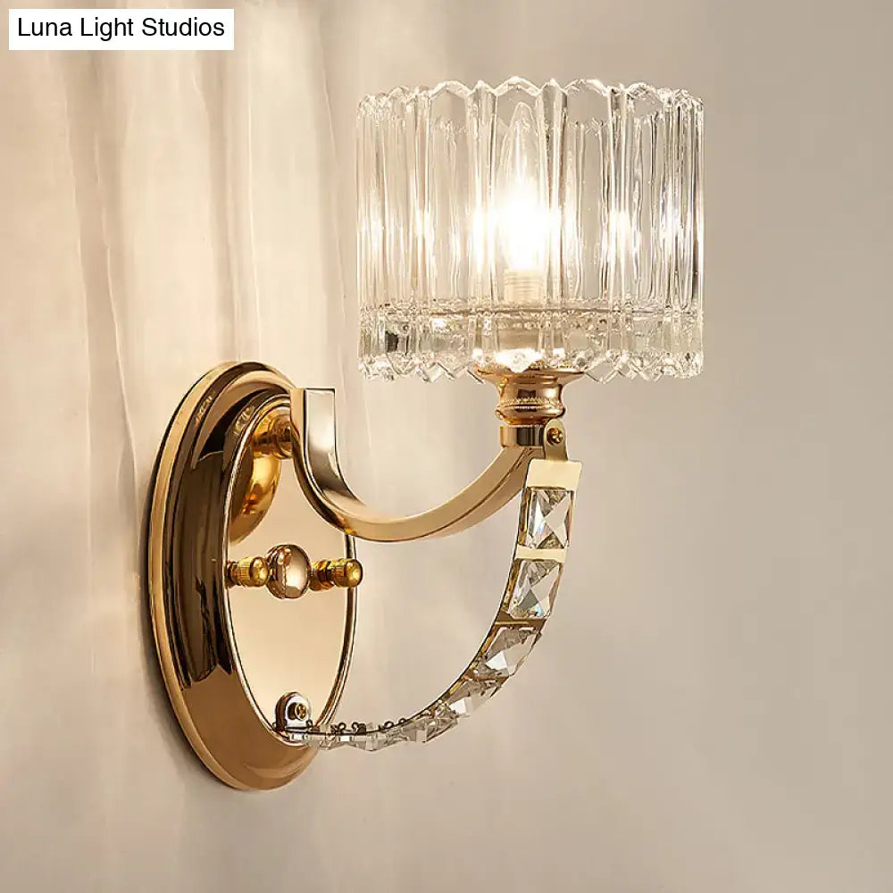 Modern brass wall sconce bedroom light with faceted clear glass shade