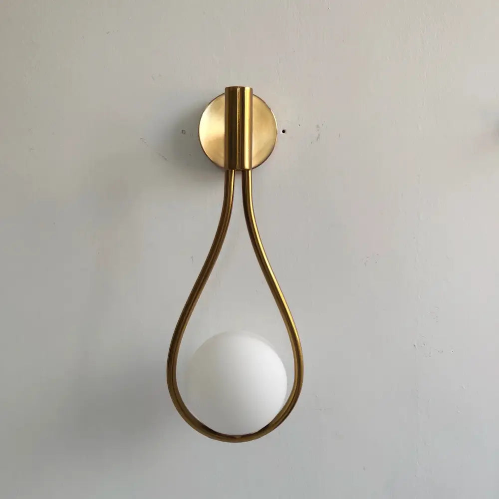 Modern brass wall sconce frosted glass teardrop living room light