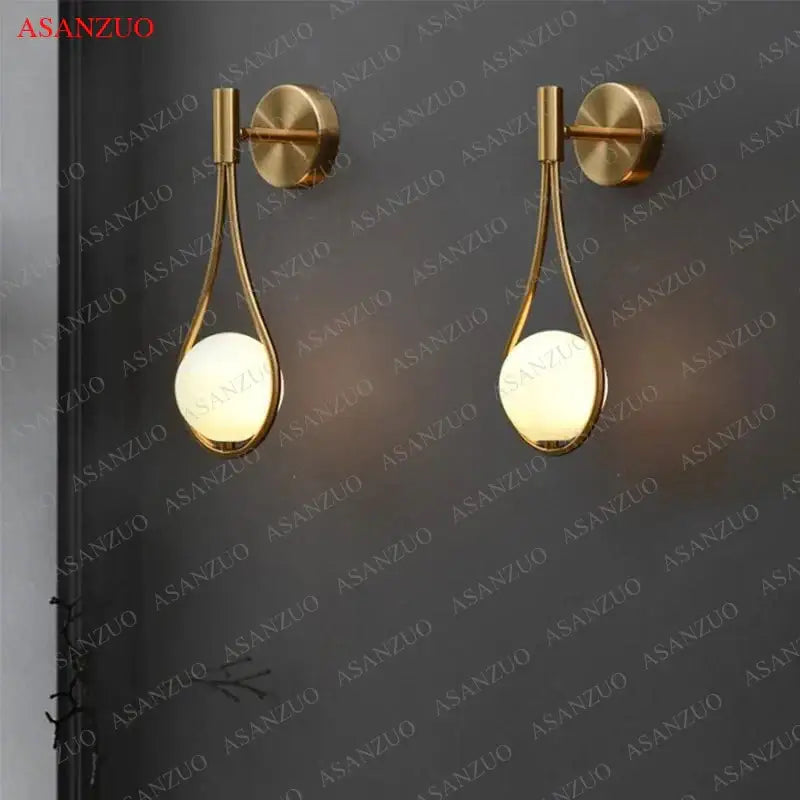 Modern brass wall sconce frosted glass teardrop living room light