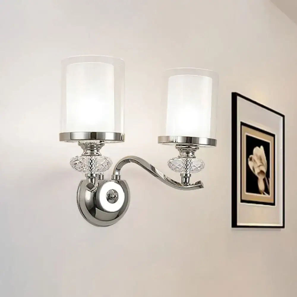 Modern chrome dual cylinder bathroom sconce with curvy arm