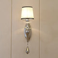 Modern chrome wall lamp with fabric shade and crystal – living room