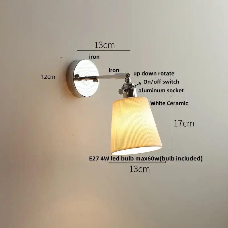 Modern chrome wall light with perforated fabric shade for bedroom