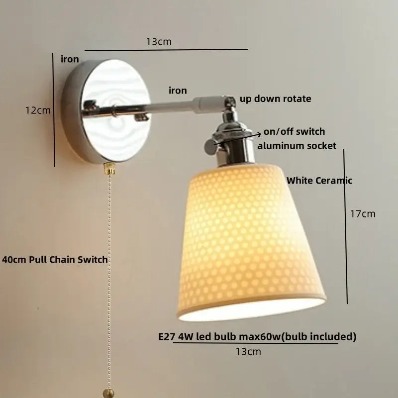 Modern chrome wall light with perforated fabric shade for bedroom