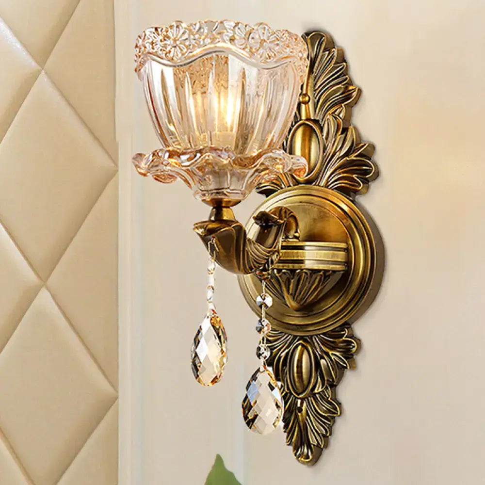 Modern floral brass wall sconce with teardrop crystal drop living room