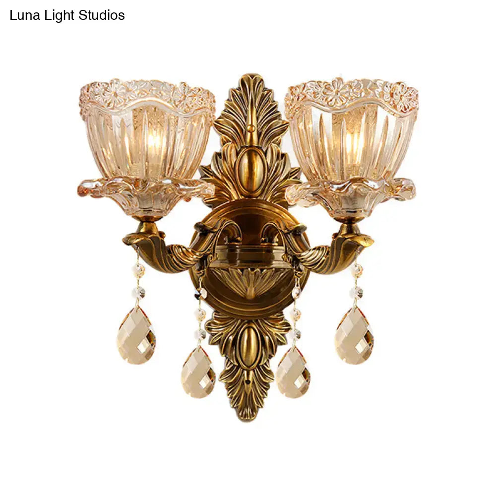 Modern floral brass wall sconce with teardrop crystal drop living room