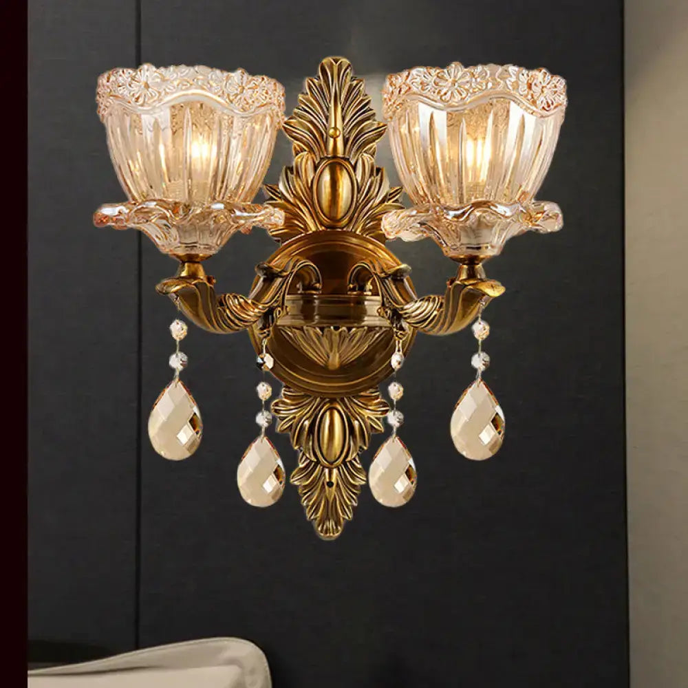 Modern floral brass wall sconce with teardrop crystal drop living room