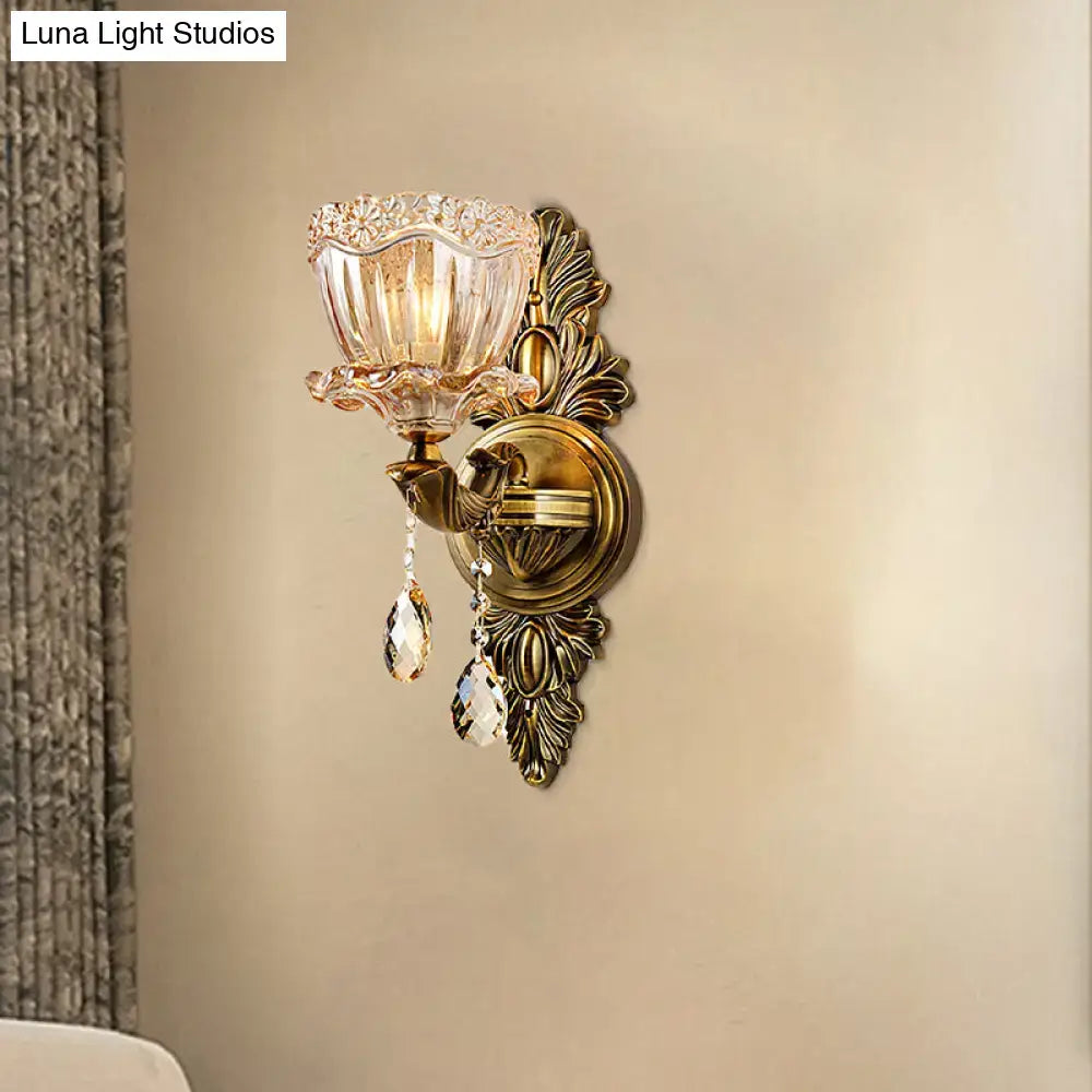 Modern floral brass wall sconce with teardrop crystal drop living room
