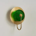 Modern gold and green glass wall sconce for bedroom lighting