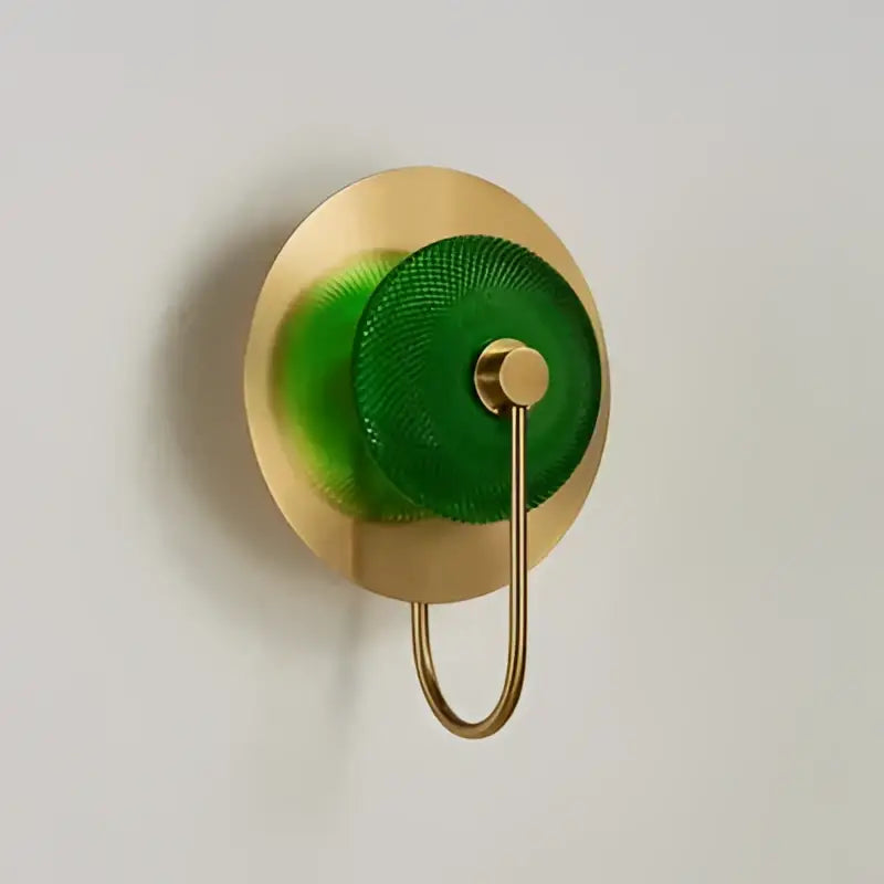 Modern gold and green glass wall sconce for bedroom lighting