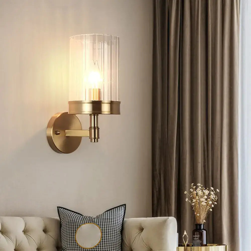 Modern gold finish wall light with glass shade – bedroom sconce