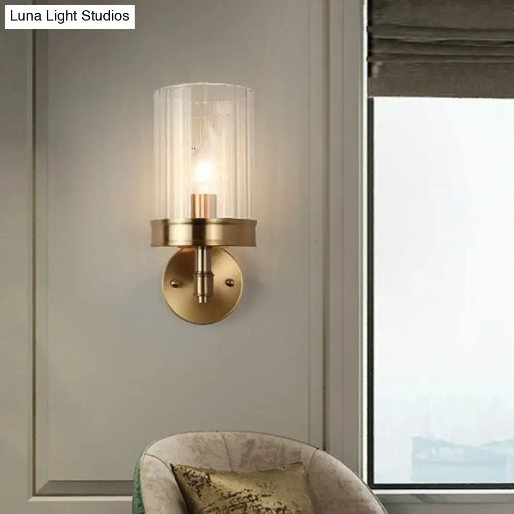Modern gold finish wall light with glass shade – bedroom sconce