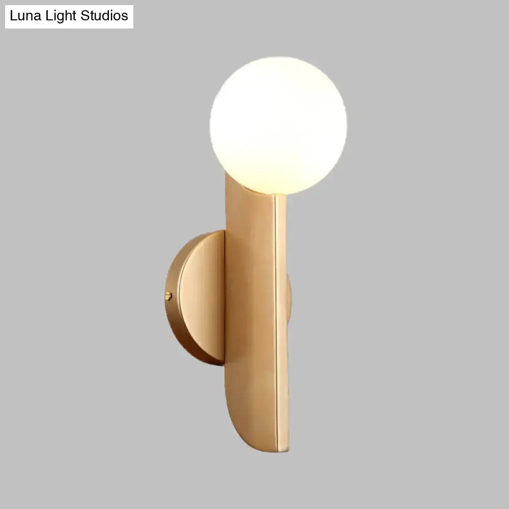 Modern gold finish wall sconce with milky glass shade bedroom light