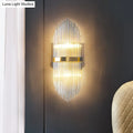 Modern gold flute shaped wall sconce with clear crystal rods bedroom