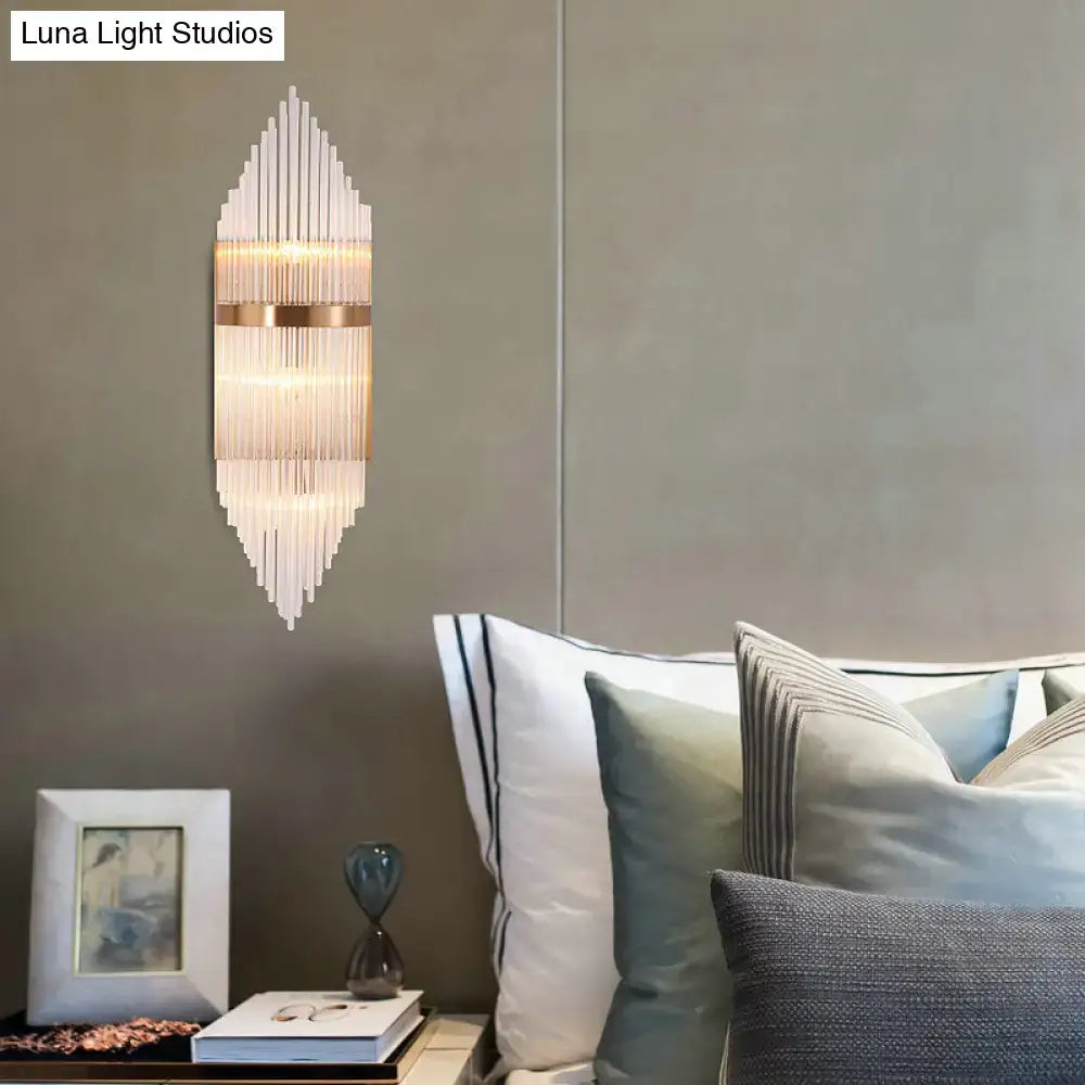 Modern gold geometric wall sconce with clear glass for living room