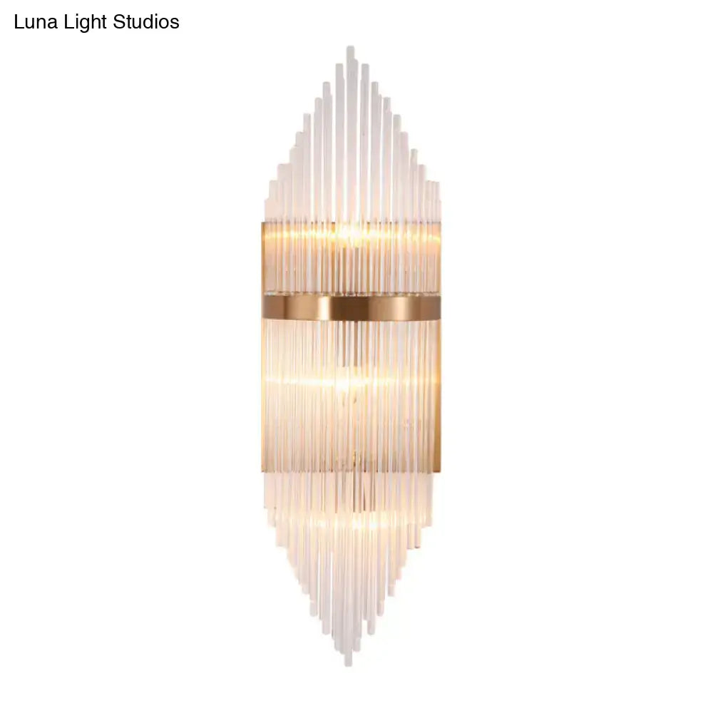 Modern gold geometric wall sconce with clear glass for living room