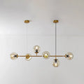 Modern gold island pendant light with glass globes for dining room