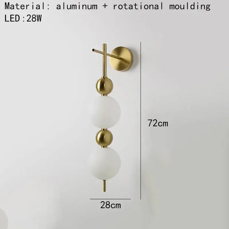 Modern gold led wall sconce with frosted glass spheres for bedroom