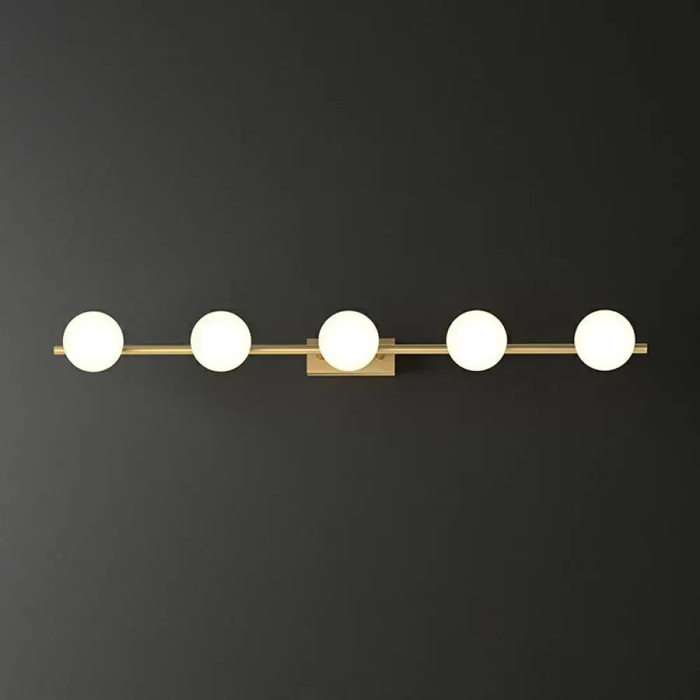 Modern gold linear wall sconce with milky ball glass for bathroom