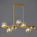 Modern gold metal amber glass island light for dining room