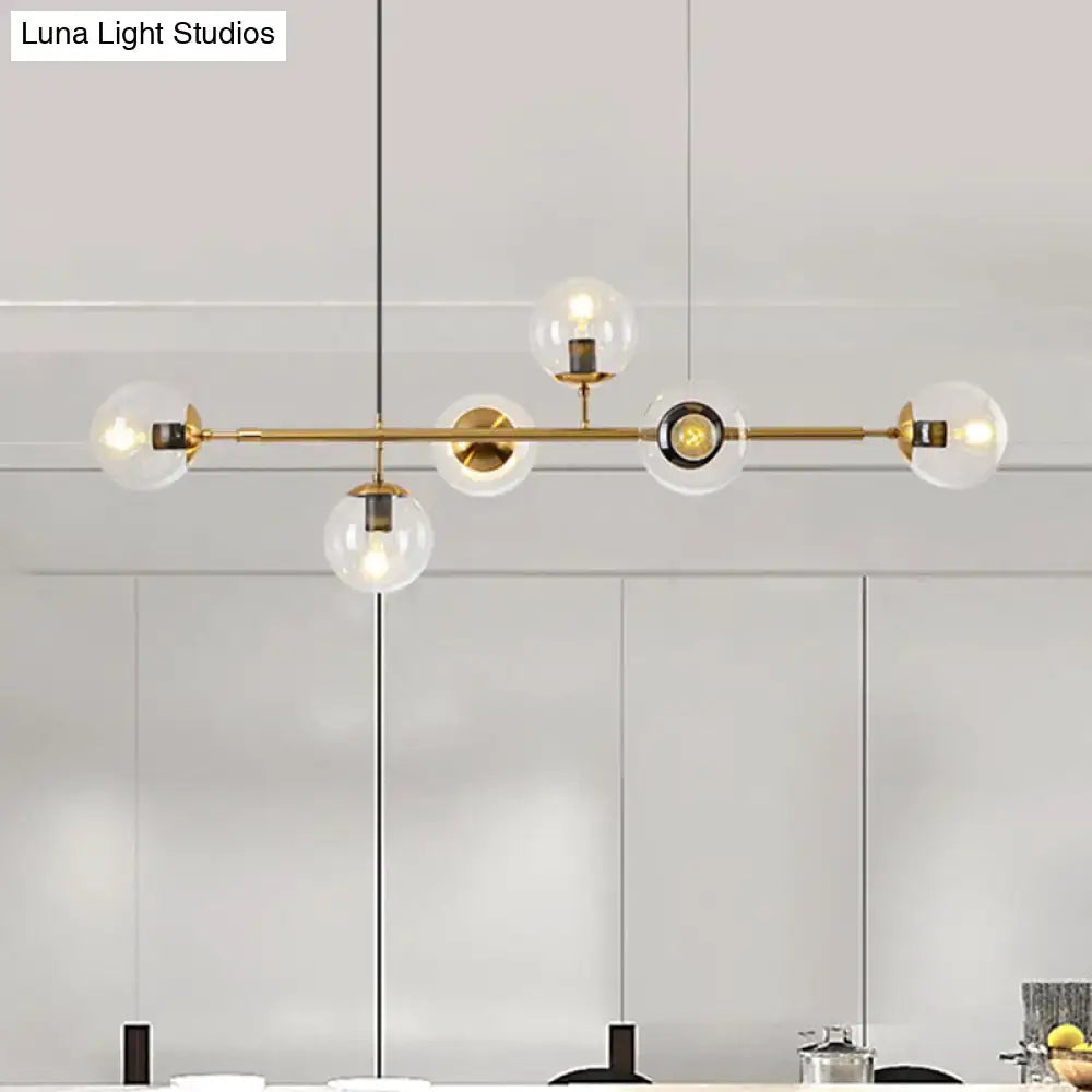 Modern gold metal island pendant with blue glass spheres dining room