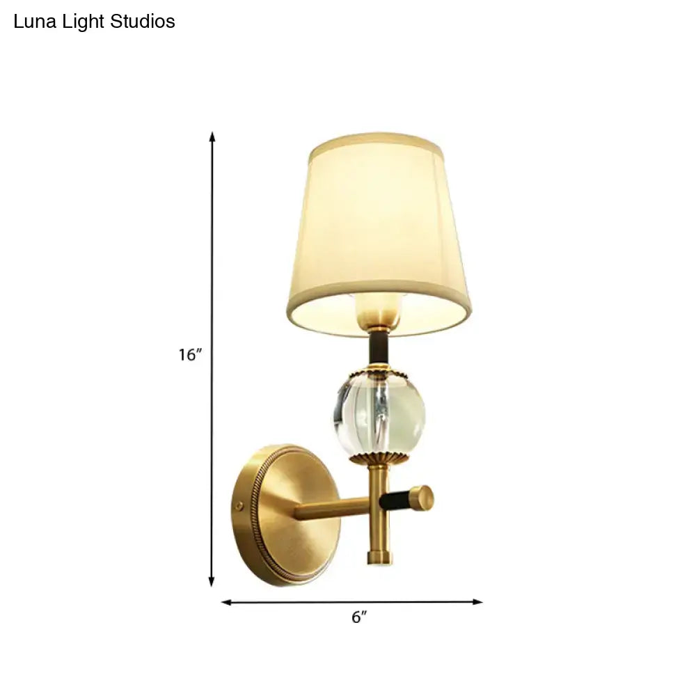 Modern gold wall light with crystal and fabric shade bedroom