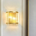 Modern gold wall sconce with clear crystal rods for hallways