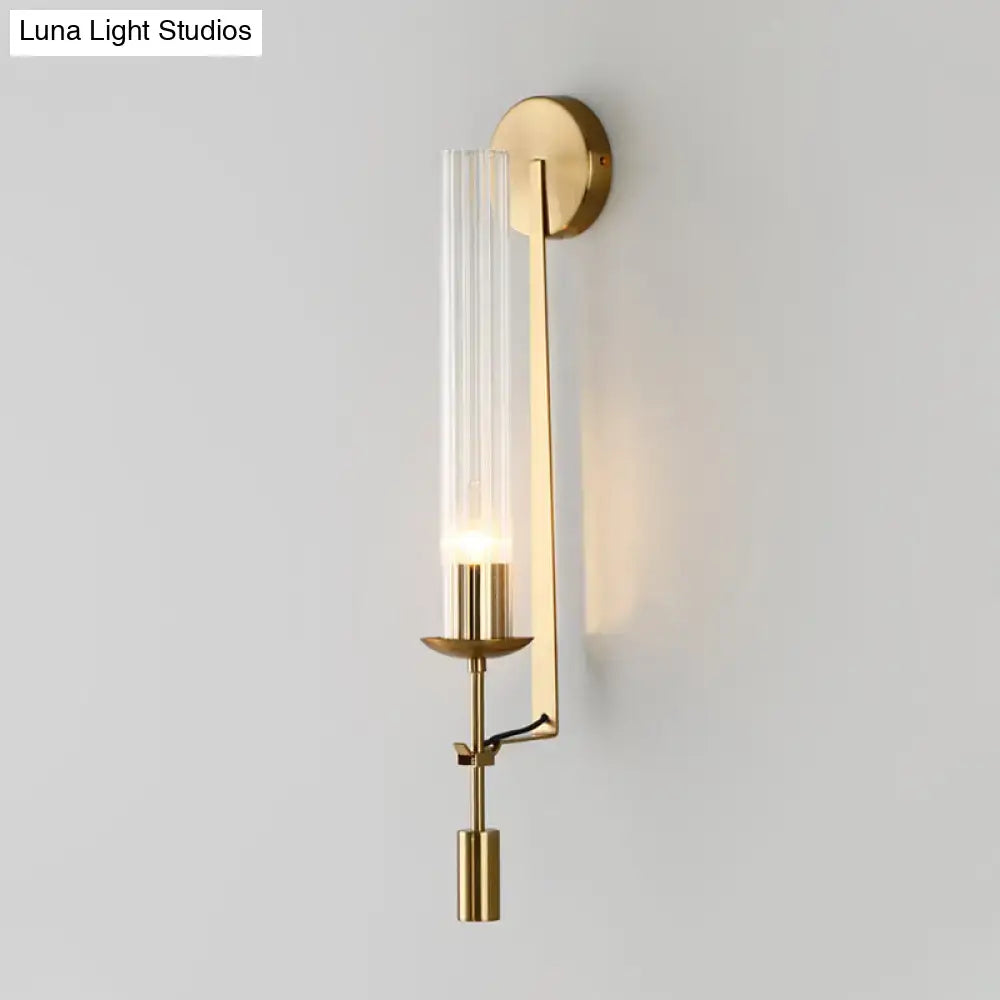Modern gold wall sconce with clear glass shade bathroom light