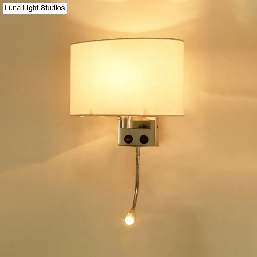 Modern gold wall sconce with fabric shade and bedroom reading light