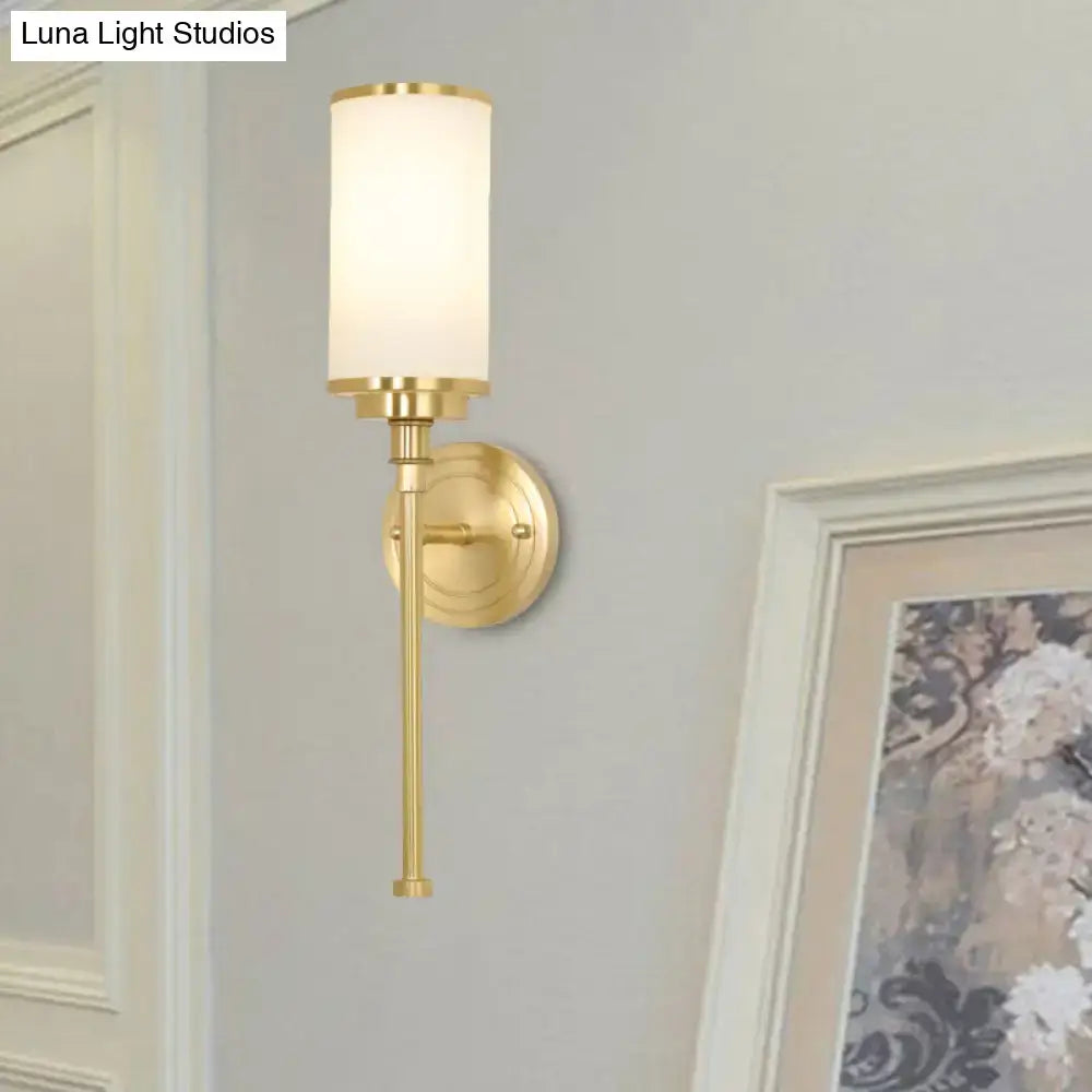 Modern gold wall sconce with milky glass shade for living room