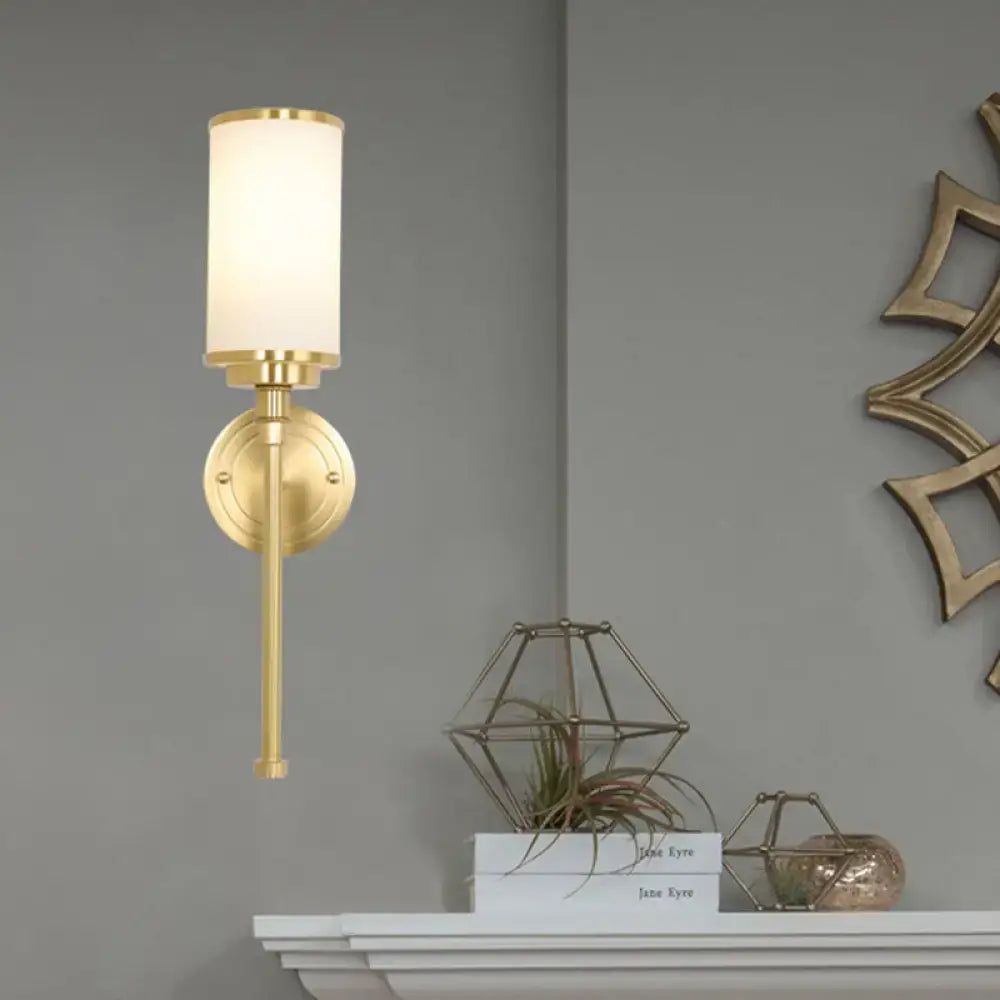 Modern gold wall sconce with milky glass shade for living room