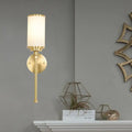 Modern gold wall sconce with milky glass shade for living room