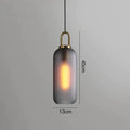 Modern gray glass ball pendant lights – dining room brass accents