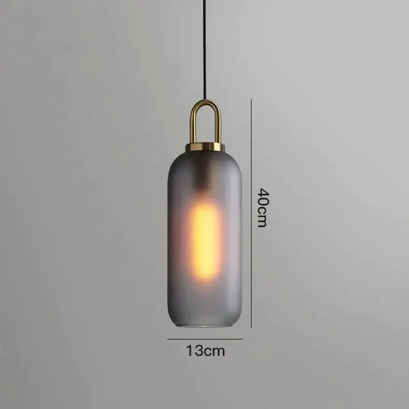 Modern gray glass ball pendant lights – dining room brass accents