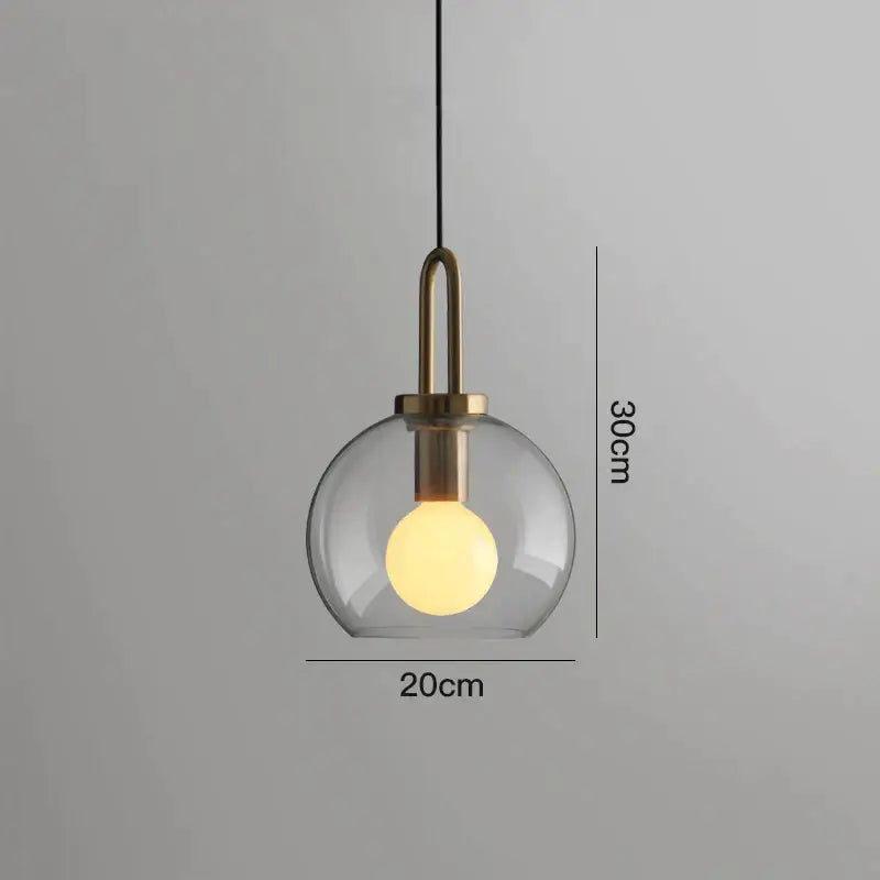 Modern gray glass ball pendant lights – dining room brass accents