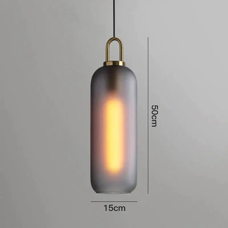 Modern gray glass ball pendant lights – dining room brass accents