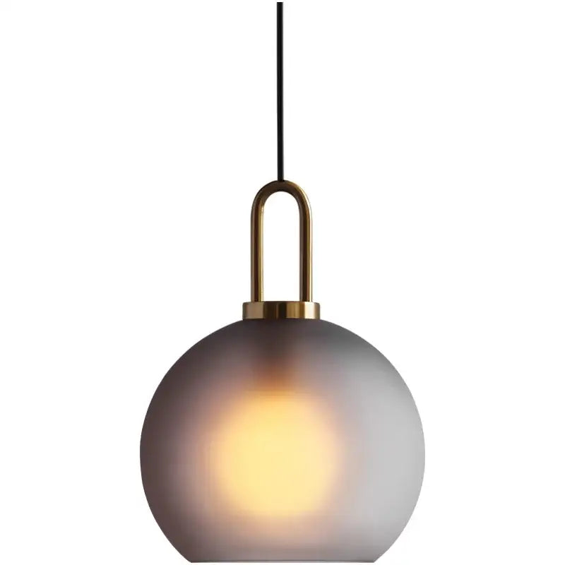 Modern gray glass ball pendant lights – dining room brass accents