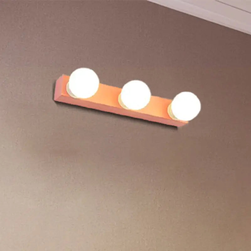 Modern orange & white 3 bulb vanity light fixture for bedroom