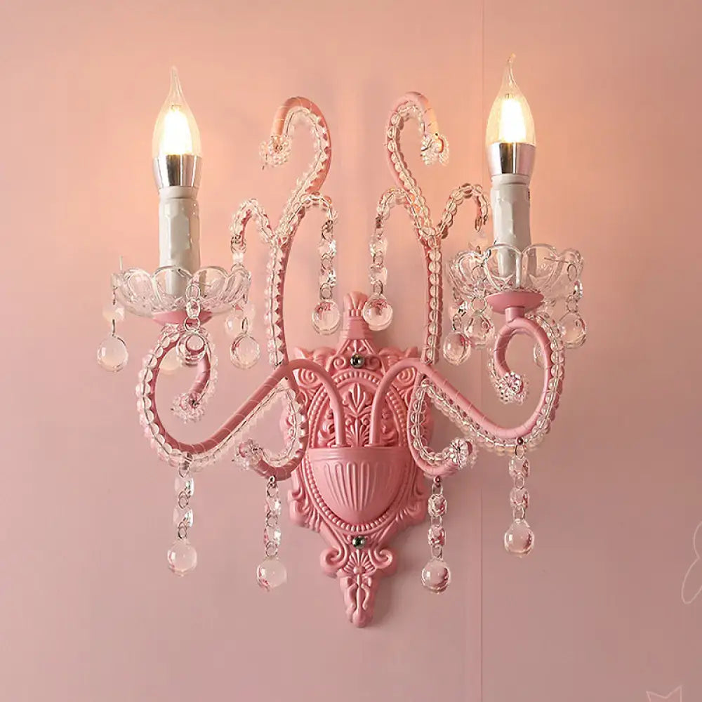 Modern pink metallic scroll arm wall lamp with crystal bedroom sconce